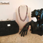 Set pochette clic clac  in cordino nero glitterato con gioielli tessili abbinati