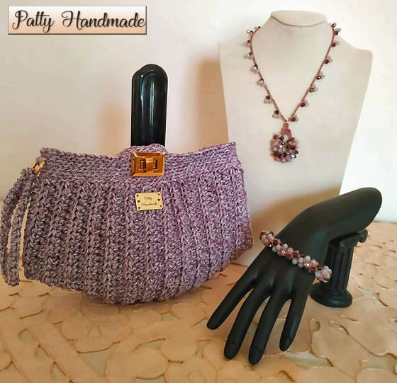 Set donna pochette, collana e bracciale ad uncinetto